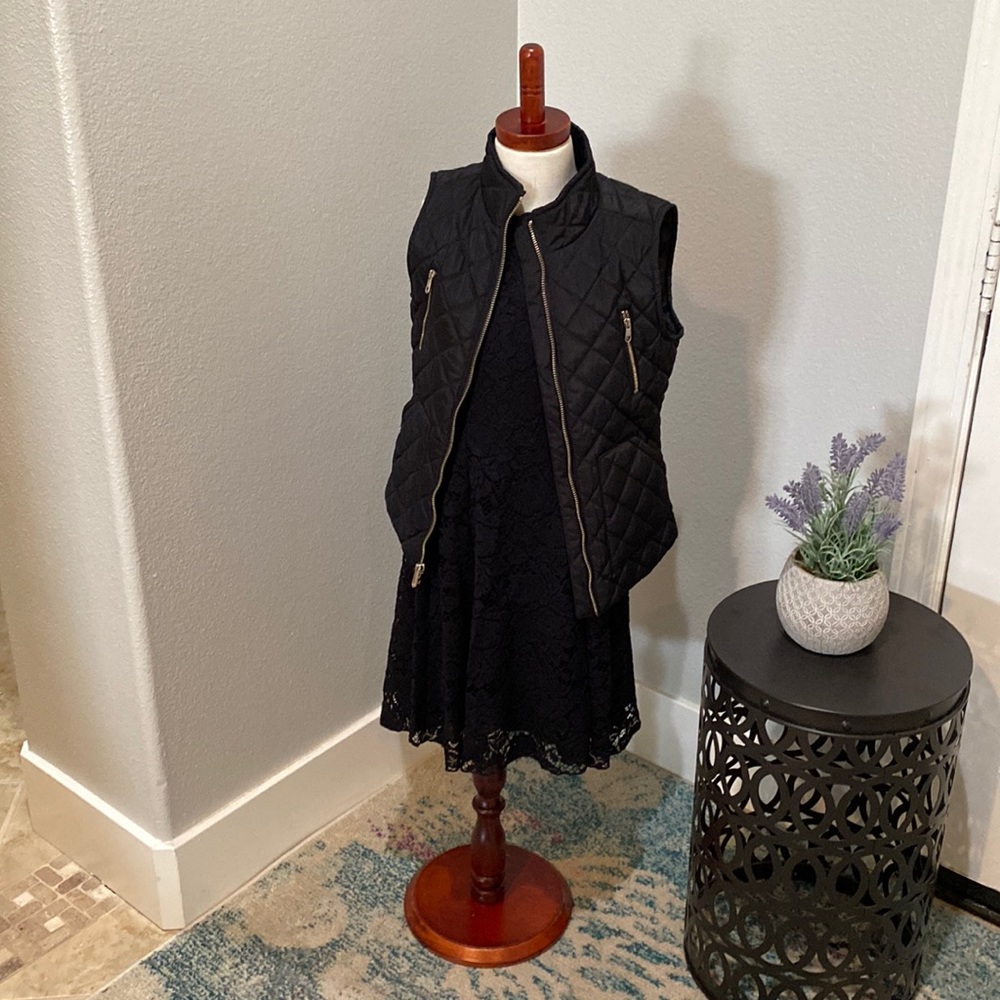 Adorable black vest with gold zipper detail